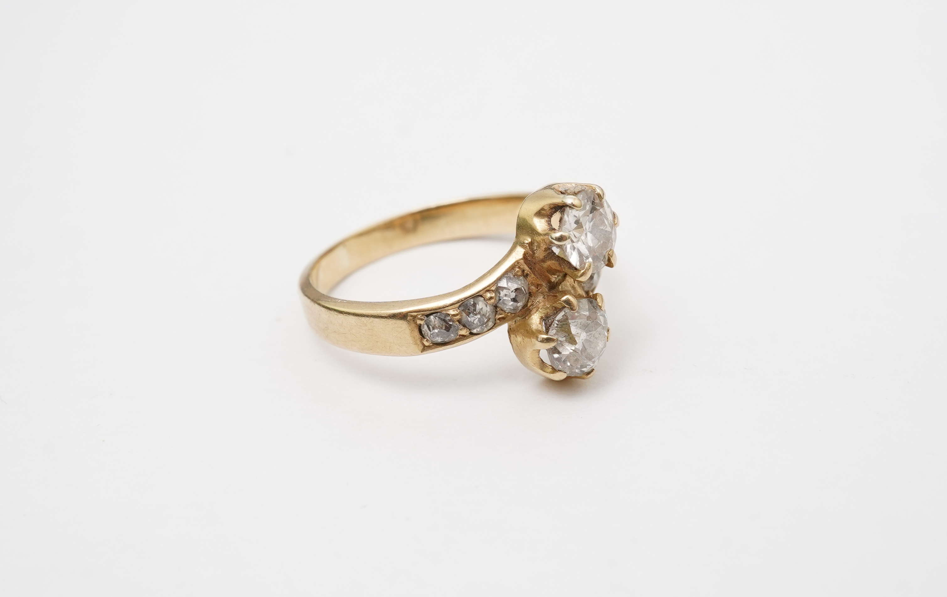 A gold and diamond 'toi-et-moi' ring, circa 1900
